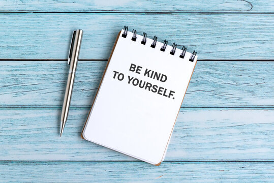 Notepad with text be kind to yourself