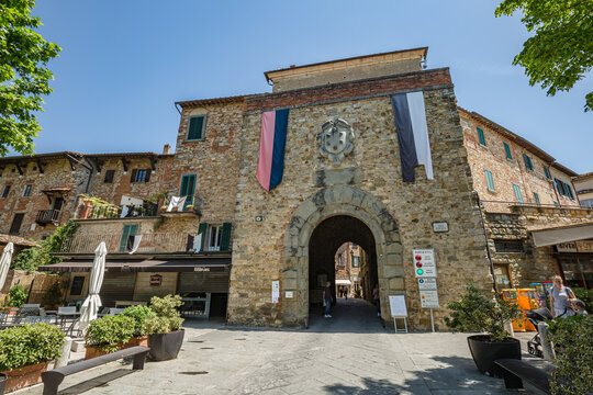 Lucignano d'Asso Montalcino, Italy - May 2022: Walking small historic town Lucignano in Tuscany, Italy. View of entrance of city center.