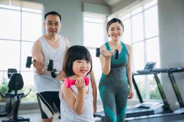 Fototapeta na wymiar Workout Routine with a Happy and Active Family. Enhancing Fitness and Wellness. Fitness Exercise concept.