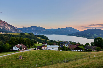 View of alpine Lake Attersee and Steinbach during sunset, Salzkammergut, Austria