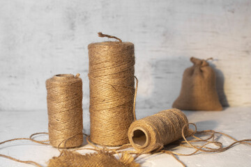 Three skeins of linen thread on the table.