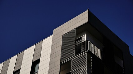 Obraz premium corner of the facade of a modern urban residential building