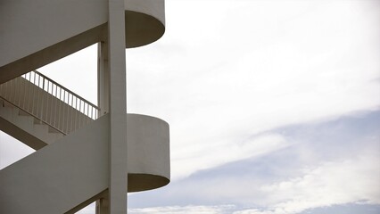 architectural structure of white concrete stairs against the sky