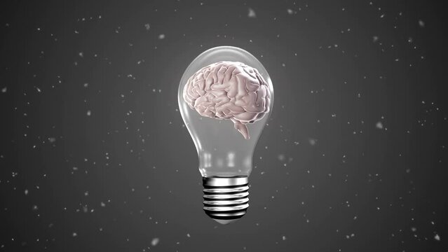 Animation of human brain in lightbulb and particles on black background