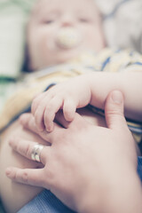 toddler holidng mothers fingers close up, love 