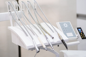 Dental instruments and control panel of contemporary high quality machine in stomatology clinic...