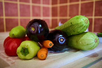 Still life with clean washed fresh ripe organic veggies for making ratatouille or stew. Food background. Close-up