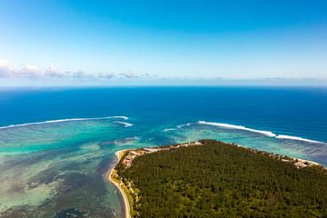 Wind surfers, turquoise ocean, beach and coral reefs from high angle view in Le Morne beach, Mauritius