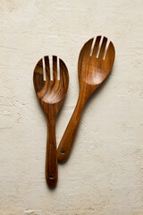 wooden spoon, with cloves, for salad, two pieces, natural wood, top view,