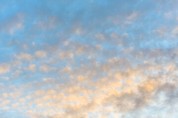 Blue sky with orange clouds at sunset