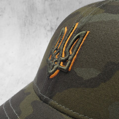 Camouflage Patriotic Cap with Ukrainian trident. This is the national coat of arms of Ukraine, not...