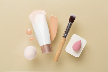 Composition with makeup foundation on color background, top view