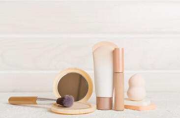 Composition with makeup products for skin tone on table