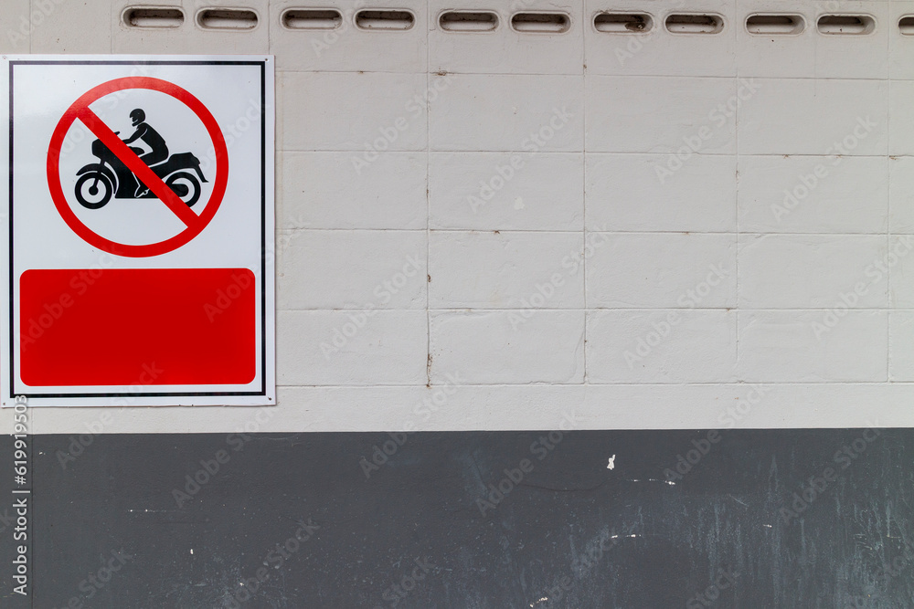 Wall mural Sign forbidden to drive motorcycles on the building attached to the corridor wall