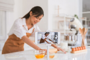 Woman making dessert and live recording.