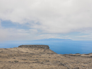 Majestic Encounter: A Rock and Island Embrace across the Ocean