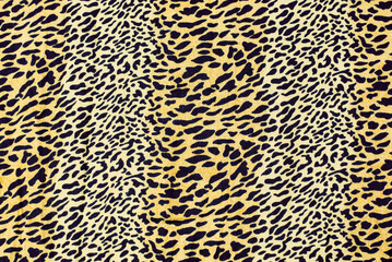 Texture and image of leopard or cheetah animal skin on fabric. Popular leopard print cheetah fabric