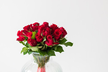A large bouquet of red roses with green petals