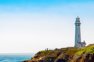 Fototapeta na wymiar Pigeon Point Lighthouse Along California Coast and Cliffs With Blue Ocean Waters