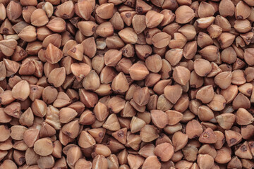 Raw buckwheat grain top view texture