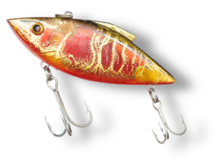 Shadow under a gold and red fishing lure