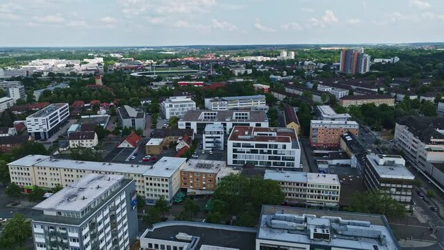 Drone shot of Wolfsburg city , Germany . It's known as the headquarters for Volkswagen and for the Autostadt, an automobile-themed park with a classic-car museum and driving track.