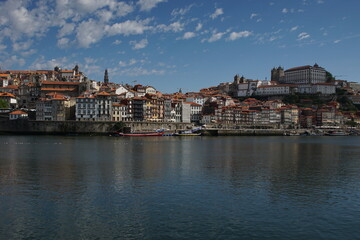 Fototapeta na wymiar The City of the Porto (Oporto), the second largest city in Portugal located on the River Douro, with barges carrying Port (fortified wine)