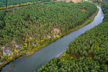 Fototapeta na wymiar landscape aerial photography river on the banks of which the forest grows