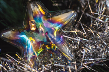 Decorative led bulb shaped as a star with christmas decorations.