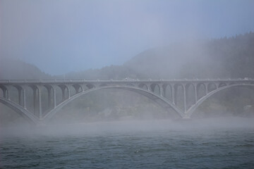 Chetco River Bridge in Brookings Oregon appears mysteriously out of mist