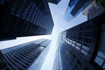 Fototapeta na wymiar New York City. Reflective skyscraper business office buildings. Bottom up view of big modern city urban landscape. Financial District