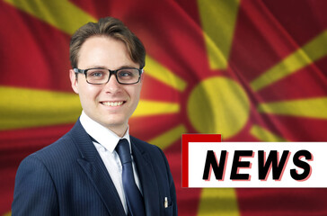 News anchor, tells the latest news, smiling, against the background of the flag of Macedonia