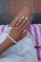 Woman's hand with bracelet and ring in boho style.