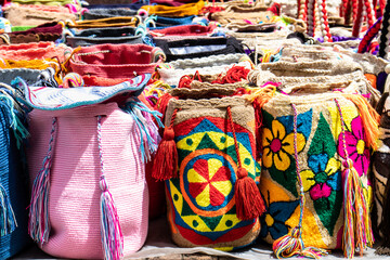 Street selling in Bogota of traditional bags hand knitted by women of the Wayuu community in...