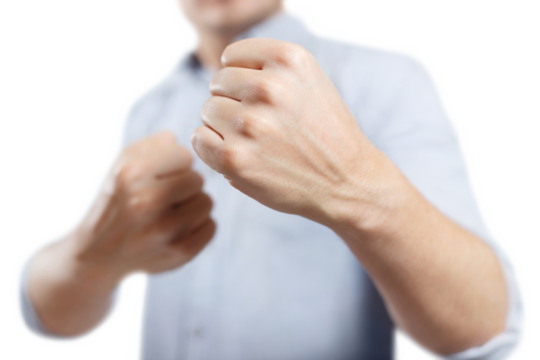 Man raised his fists ready to fight, cut out