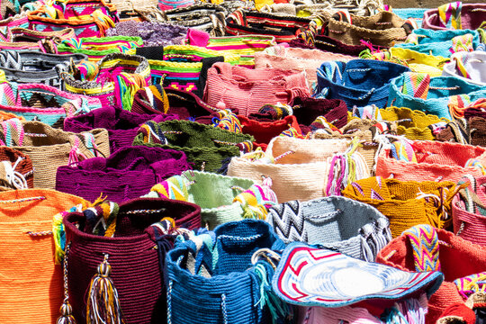 Street selling in Bogota of traditional bags hand knitted by women of the Wayuu community in Colombia called mochilas