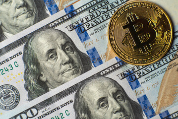 Obraz na płótnie Canvas Bitcoin and dollars close up