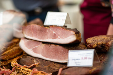 Selection of assorted home made meats, jerky and sausages on a farmers market in Vilnius, Lithuania.