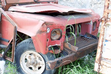 Ravaged Red Off-Road Vehicle: A Glimpse of Destruction