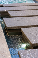 High-end custom outdoor swimming pool design and backyard construction & development photography.