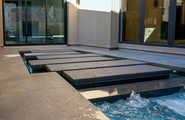 High-end custom outdoor swimming pool design and backyard construction & development photography.