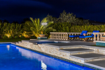 High-end custom outdoor swimming pool design and backyard construction & development photography.