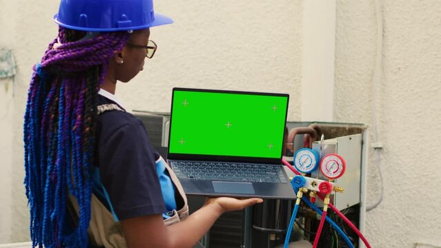 Meticulous wireman ordering new internal components on mock up laptop for malfunctioning HVAC system after finishing maintenance. Licensed serviceman looking online for condenser replacement parts