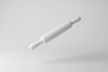 White rolling pin floating in mid air on white background in monochrome and minimalism. Illustration of the concept of bakery, cookery and culinary 