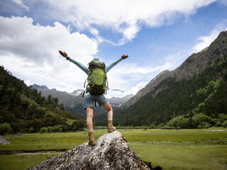 Hiking woman in high altitude mountains