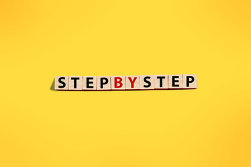 Step by step, text words typography written with wooden letter, life and business motivational inspirational