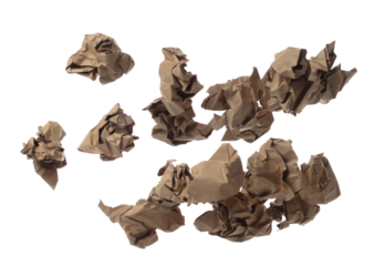 Brown Crumpled paper ball is symbol of frustration discarded ideas, isolated white background. Crumpled paper ball write creative drawing, problem-solving, potential artwork. Many recycle paper angle