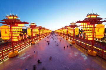 Chinese lanterns by the river in winter，Chinese festive lantern at night © zhengzaishanchu