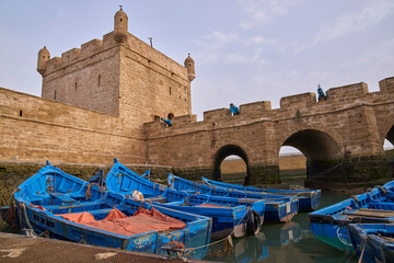 Essaouira port, Morocco - old and picturesque fishing port famous for blue wooden boats. Artillery...
