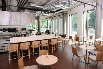 Fototapeta na wymiar Modern cafe with stylish furniture. Interior design
